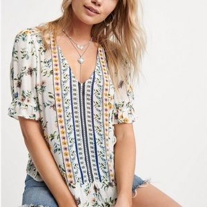 Lucky Brand. Delicate top with ruffle hems and floral prints, a romantic look.